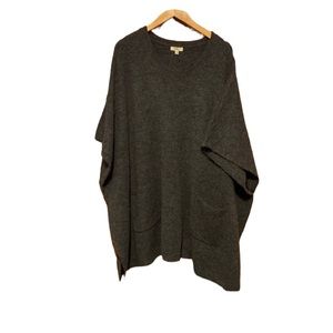 Kori dark gray poncho with pockets size M/L. Has arm holes.